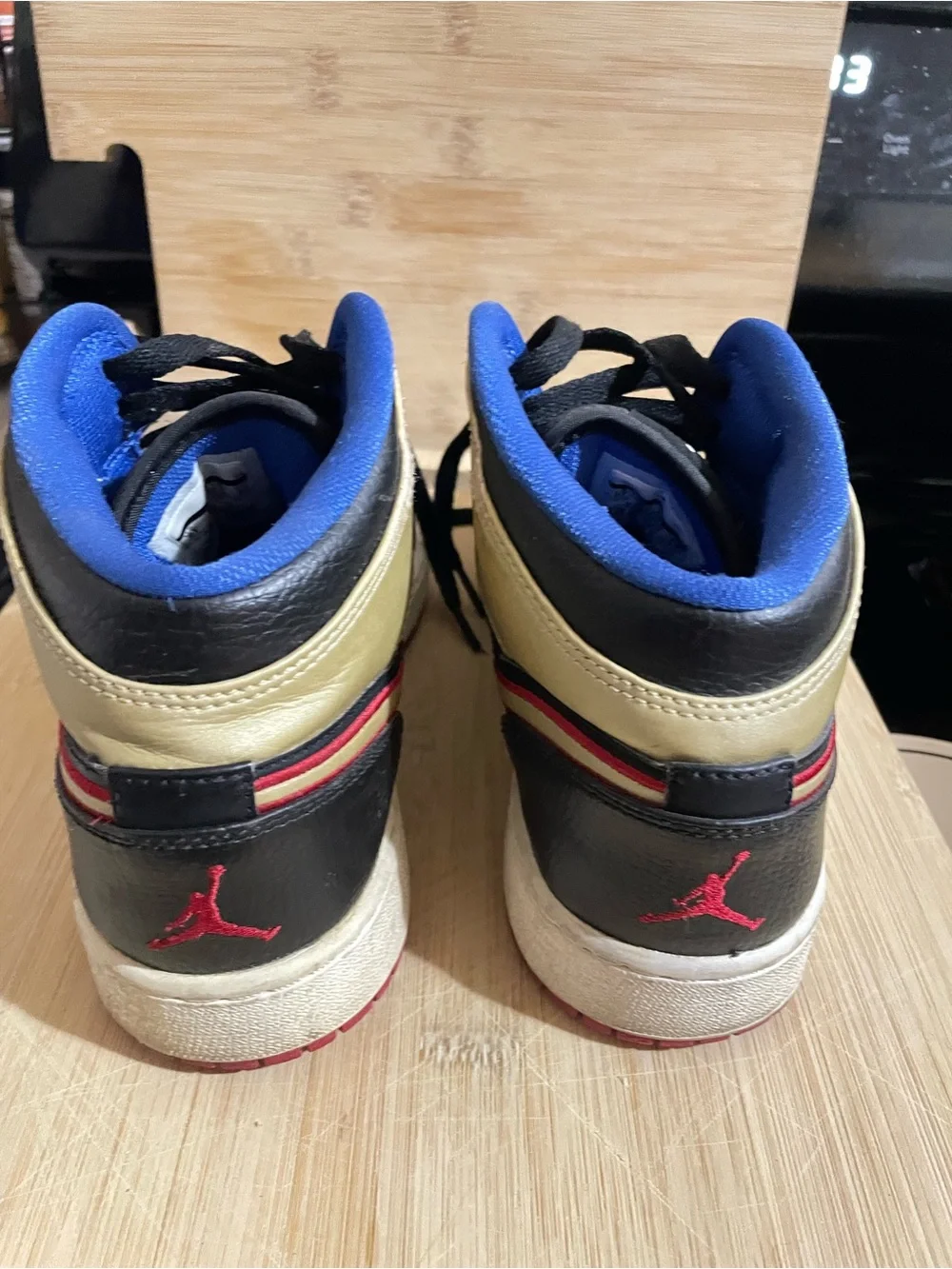 Nike Kids Black and Gold High-Top Sneakers with Blue Lining